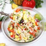 Jalapeno Pineapple Coleslaw spoonful over bowl.