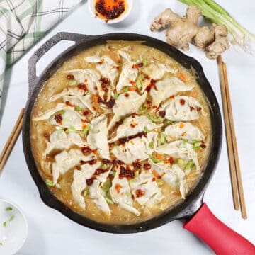 One Pan Dumpling Bake with chicken and garnish of chili crisp.