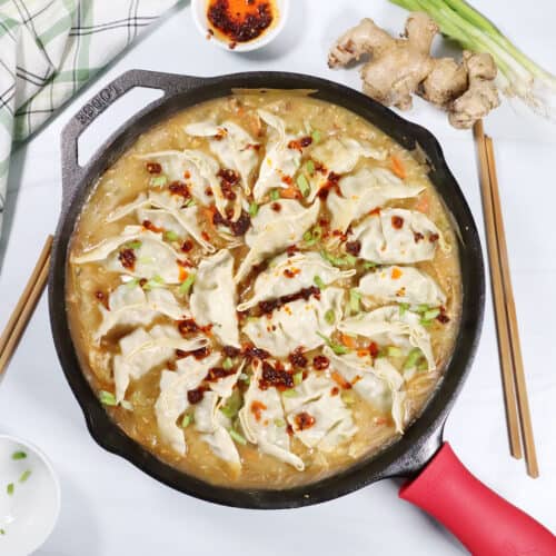 One Pan Dumpling Bake with chicken and garnish of chili crisp.