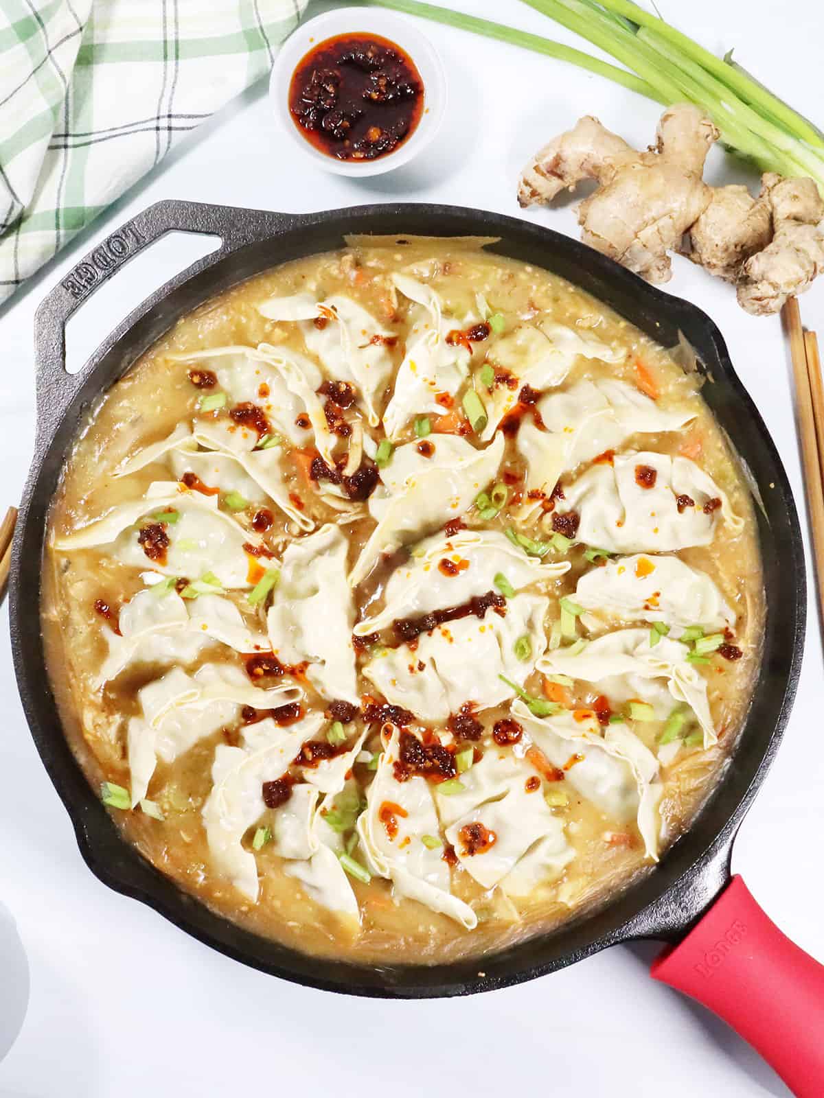 One Pan Dumpling Bake with drizzle of chili crisp.