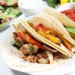 Tortillas filled with chicken fajita mixture.
